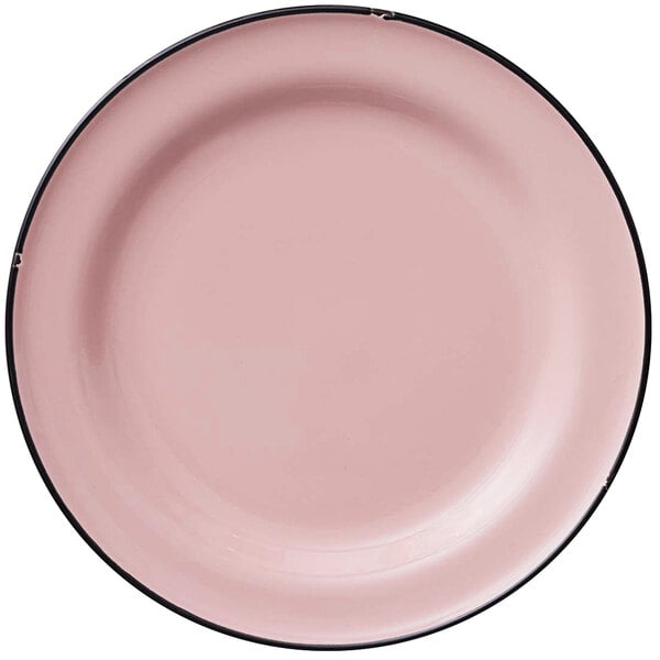 A close up of a Luzerne pink porcelain plate with a black rim.