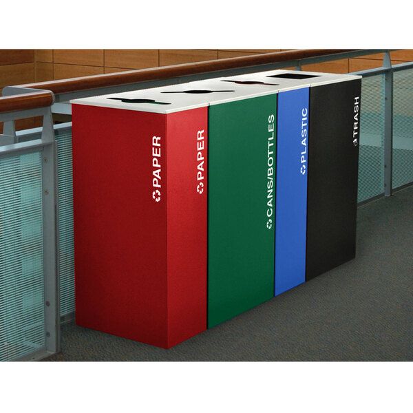 A row of Ex-Cell Kaiser emerald texture square recycle bins in different colors. The bin in the middle is emerald green with white text.