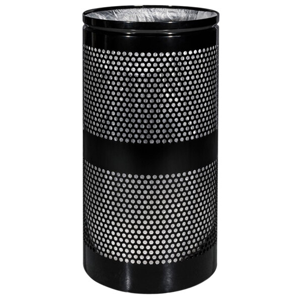 A close-up of a black Ex-Cell Kaiser Landscape Series waste receptacle with silver accents and holes in it.
