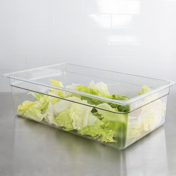 A clear plastic container of lettuce with a plastic lid.