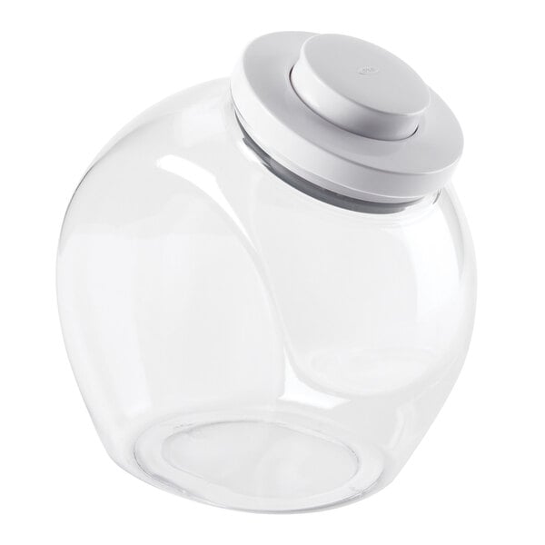 A clear round plastic food storage container with a white lid.