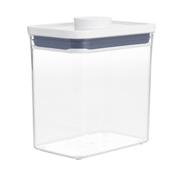 An OXO clear plastic food storage container with a white lid.