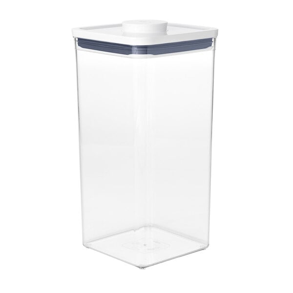 A clear square plastic container with a white lid.