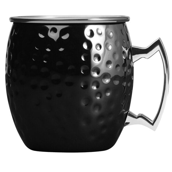 An Arcoroc black metal mug with a silver handle.