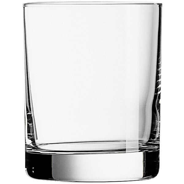 An Arcoroc old fashioned glass filled with ice on a white background.