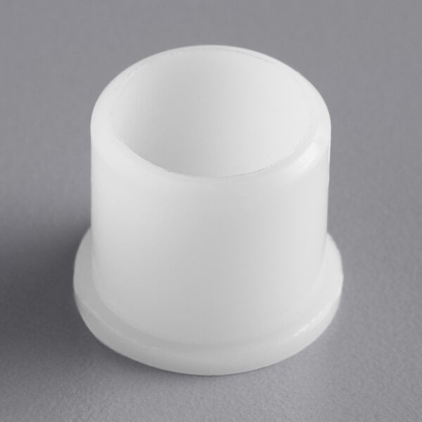 A white plastic cylinder with a round top.