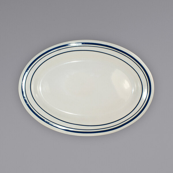 An ivory stoneware platter with blue lines.