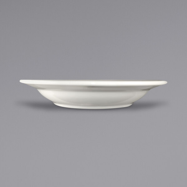 A close up of a white International Tableware Newport stoneware bowl with an embossed rim.