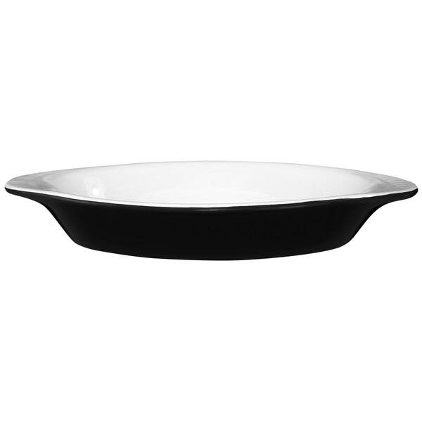 An International Tableware black and white two-tone oval rarebit dish.