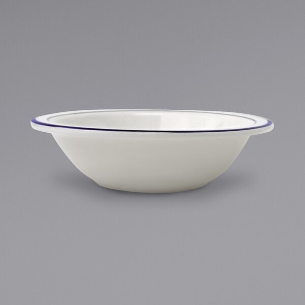 A white stoneware bowl with blue bands.
