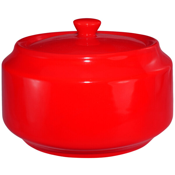 A crimson red stoneware sugar bowl with lid.