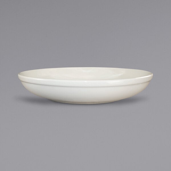 An International Tableware ivory stoneware bowl with a rolled edge.