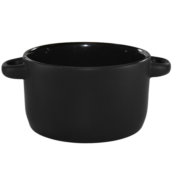 A black stoneware mini casserole dish with handles.