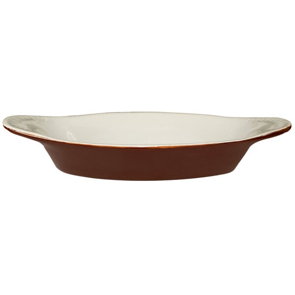 An International Tableware brown and ivory oval two-tone stoneware dish.