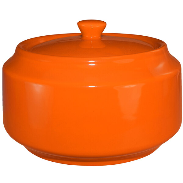 An orange ceramic pot with a lid.