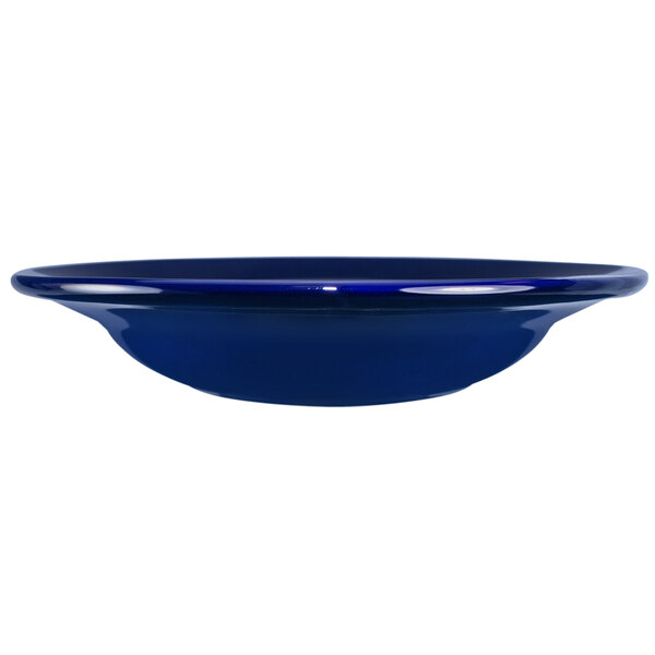 A close-up of a cobalt blue International Tableware stoneware bowl.