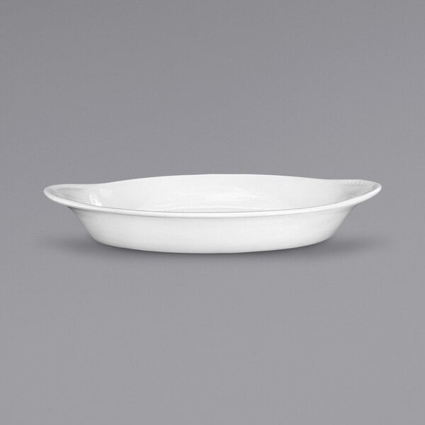 An International Tableware European white stoneware rarebit dish with an oval shape.