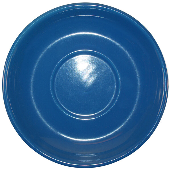 A light blue stoneware saucer with a rim and circle in the middle.