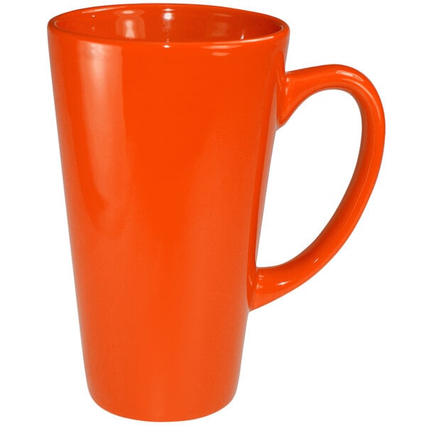 An orange stoneware funnel cup with a handle.