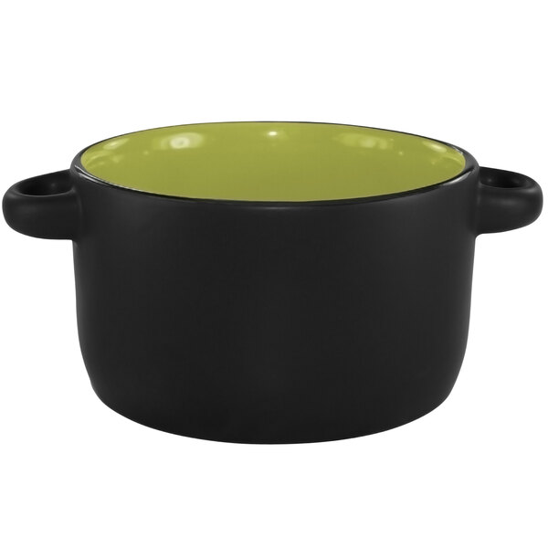 A black and green stoneware bowl with handles and a lid.