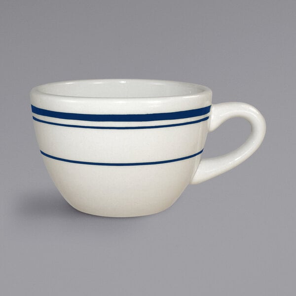 An International Tableware Catania stoneware low cup with blue bands on a white background.
