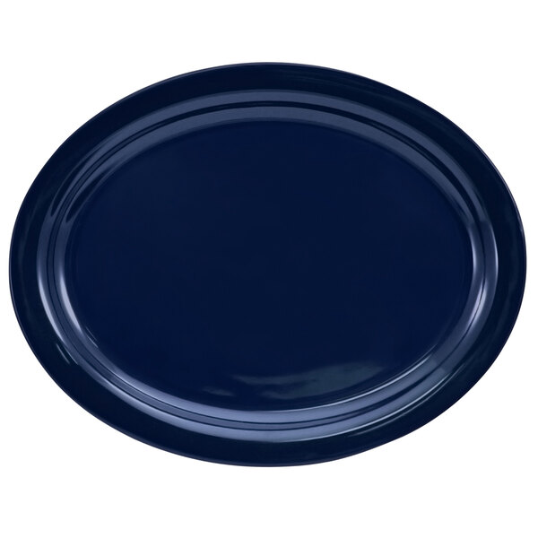 An oval cobalt blue stoneware platter with a narrow rim.