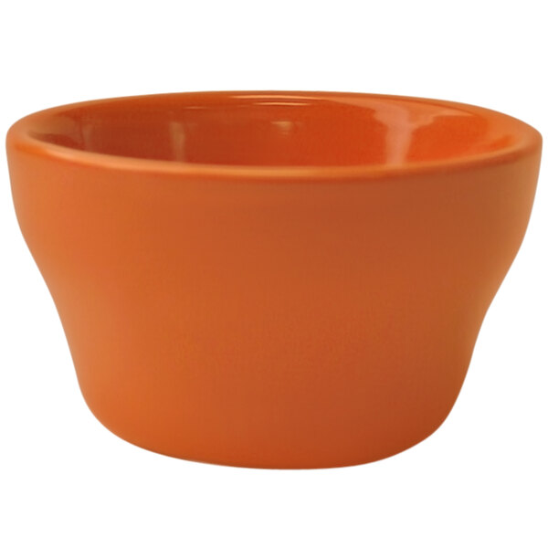 An orange International Tableware stoneware bouillon bowl.