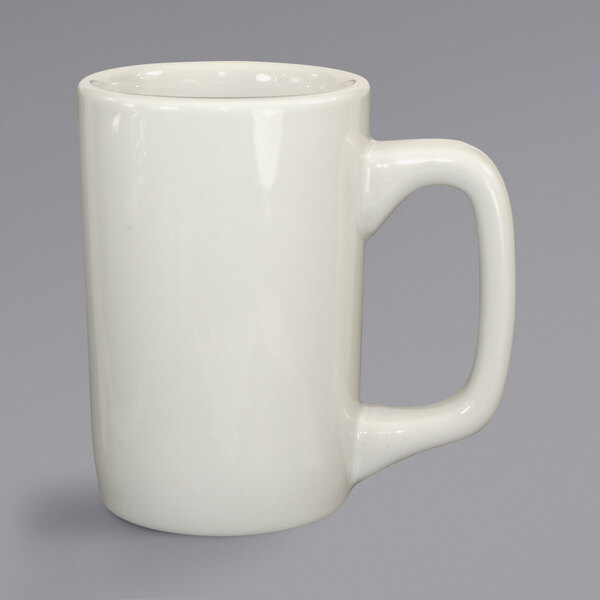 A white mug with a handle.