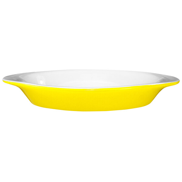 A yellow and white International Tableware rarebit dish.