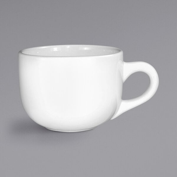 A white International Tableware stoneware latte cup with a handle.