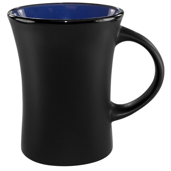 A black stoneware mug with blue inside and black outside and a blue rim.
