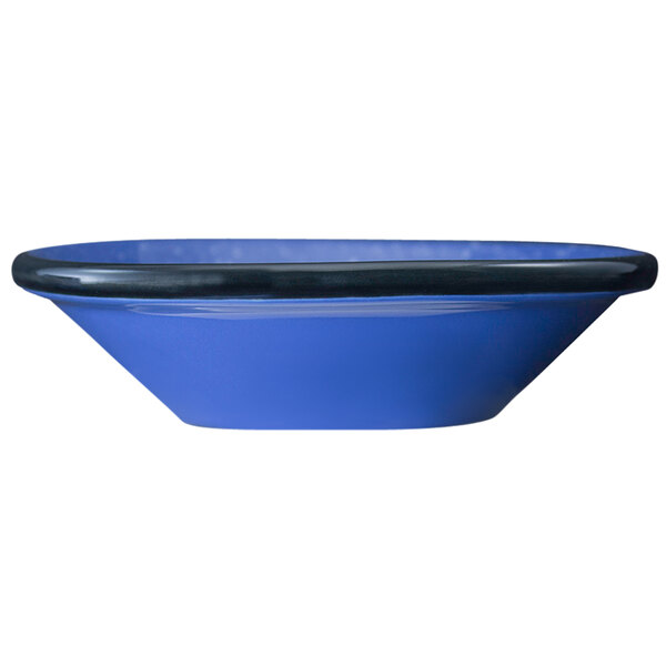 An International Tableware stoneware fruit bowl with an ocean blue speckled surface and black rim.