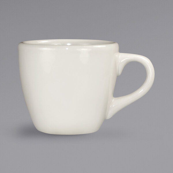 An International Tableware ivory stoneware espresso cup with a handle.