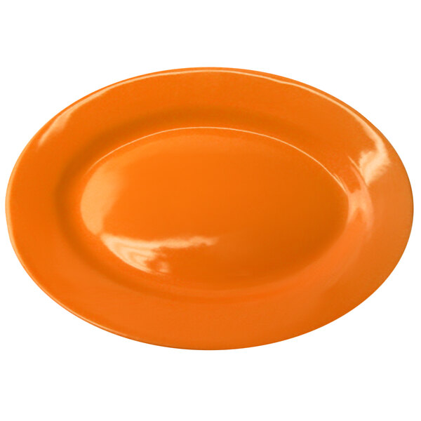 An International Tableware orange stoneware platter with a wide rim on a white background.