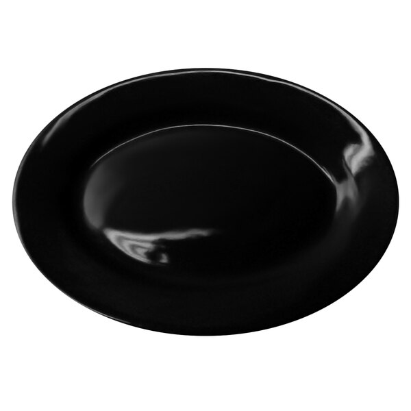 A black stoneware platter with a wide rim.