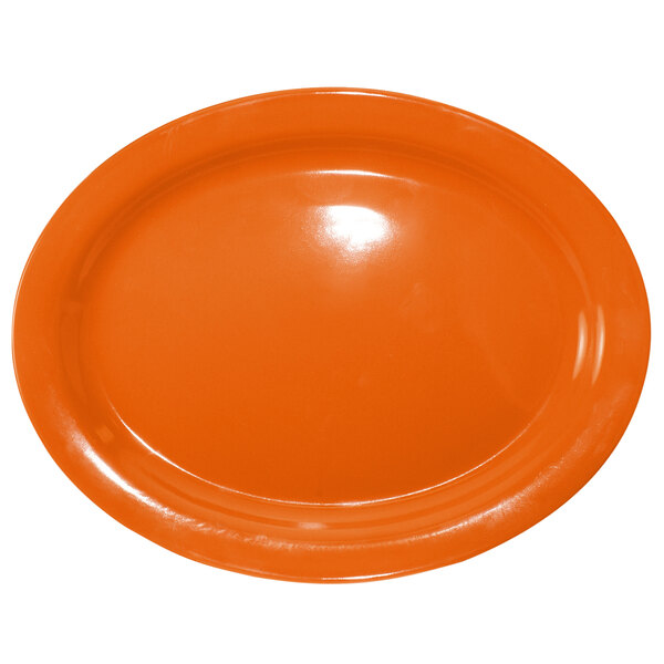 An orange stoneware platter with a narrow rim on a white background.