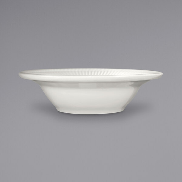 An International Tableware Athena stoneware bowl with a wide rim on a gray background.