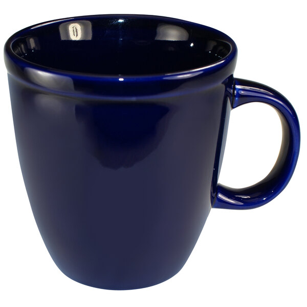 An International Tableware cobalt blue stoneware mocha mug with a handle.
