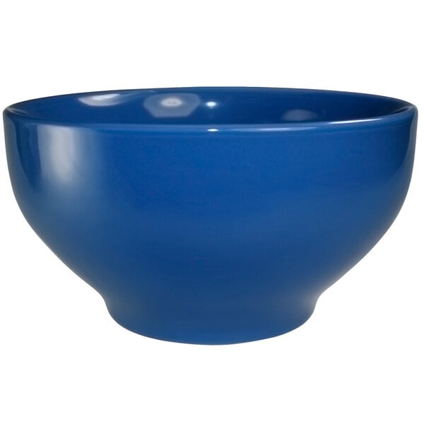 A light blue International Tableware stoneware footed bowl.