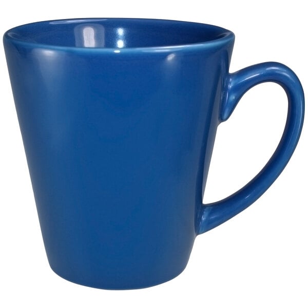 A close-up of a light blue stoneware coffee mug with a handle.