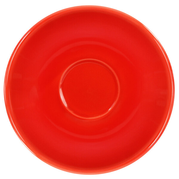 A crimson red International Tableware saucer with a circle in the middle.