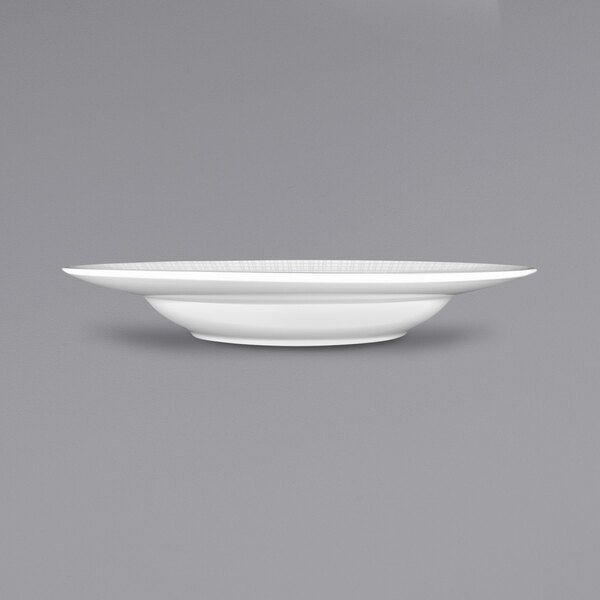 A white porcelain pasta bowl with a rim.
