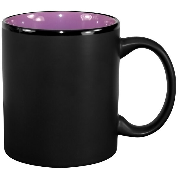 A black stoneware mug with a purple rim and handle.