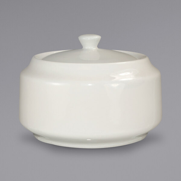 An International Tableware ivory ceramic sugar bowl with a lid.