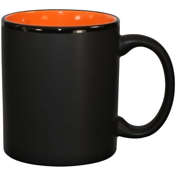 An orange stoneware coffee mug with a black rim and interior.