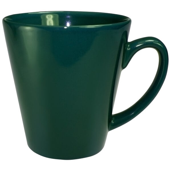 A green stoneware cup with a handle.