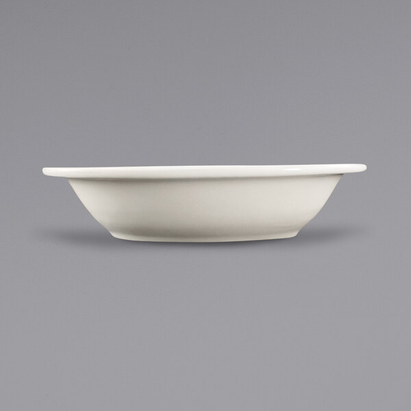A close-up of an International Tableware Valencia ivory serving bowl.
