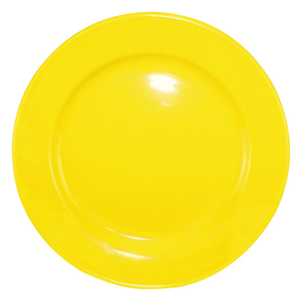 A yellow International Tableware stoneware plate with a white circle around the edge.