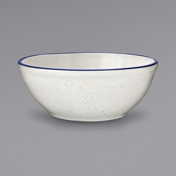An ivory stoneware bowl with blue bands.