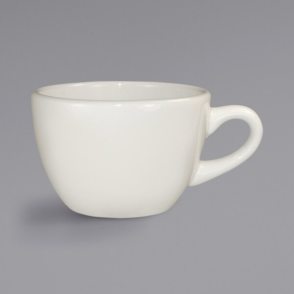 A white International Tableware Valencia low cup with a handle.